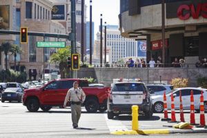 RACHEL ASTON/LAS VEGAS REVIEW-JOURNAL VIA AP
                                Police work at the scene where multiple people were stabbed in front of a Strip casino in Las Vegas.