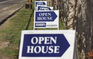 CINDY ELLEN RUSSELL / 2014
                                Open-house signs direct potential buyers to a housing development along Farrington Highway.