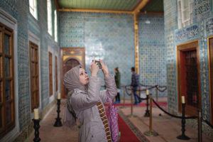 NEW YORK TIMES
                                A woman takes pictures in Hünkar Kasri in Istanbul in November 2019. All the walls at Hünkar Kasri are covered in rare and exquisite Iznik tiles from the 17th century, some specially created for this building.