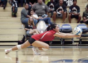 CINDY ELLEN RUSSELL / CRUSSELL@STARADVERTISER.COM
                                Iolani’s Grace Wee (3) dives for the ball during the fourth set of the quarterfinals match against the King Kekaulike Na Ali’i at the HHSAA Division 1 girls volleyball state championships.