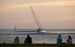 CINDY ELLEN RUSSELL / CRUSSELL@STARADVERTISER.COM
                                A 90-foot sailboat, called the Criterion, ran into a reef roughly 500 yards off Fort DeRussy in Waikiki Sunday afternoon with about 30 adults onboard. All the passengers were transported onto the vessel safely. Pictured is the sailboat listing in the waves about 500 yards from shore near Fort DeRussy in Waikiki.