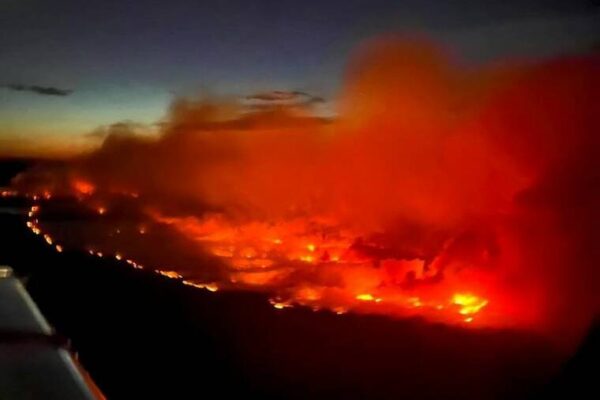 Canadian crews battle wildfire threatening remote western town