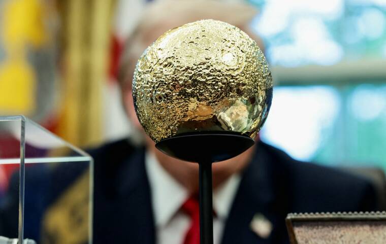 REUTERS/EVELYN HOCKSTEIN
                                A golden moon sits on the desk in front of President Donald Trump as he takes questions from the media during an event with Artemis II astronauts in the Oval Office at the White House in Washington, D.C., on April 29. Russia and China said today that President Donald Trumps Golden Dome missile-defense shield plans threatened strategic stability and that Washington had been irresponsible not to work on a replacement for a landmark nuclear treaty.