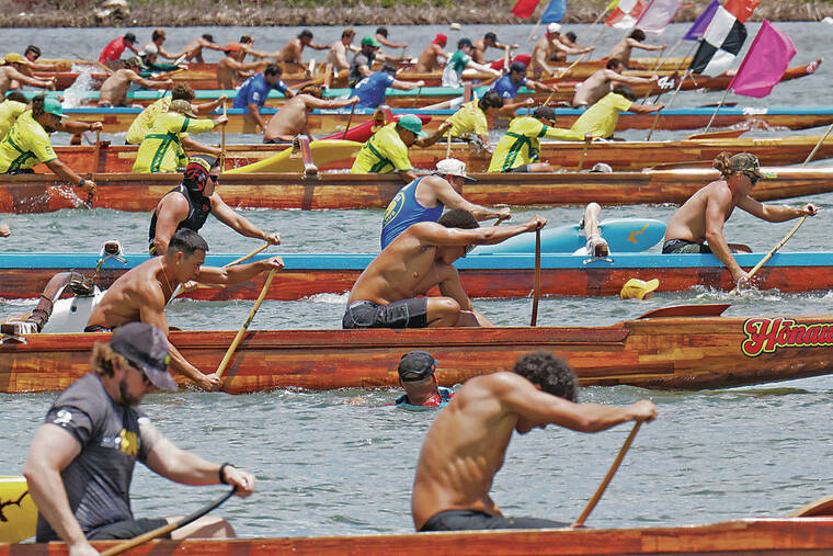 JAMM AQUINO / JAQUINO@STARADVERTISER.COM
                                Above, the mens junior event began during Sundays Oahu Hawaiian Canoe Racing Association Championship regatta at Keehi Lagoon.