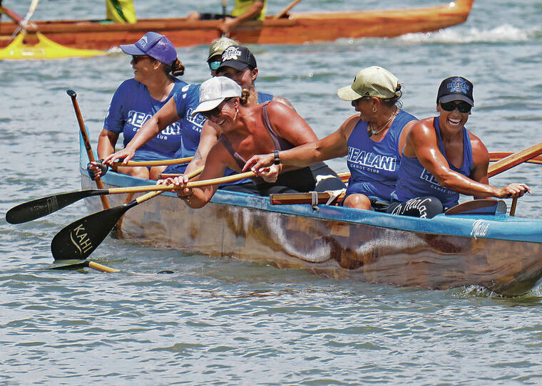JAMM AQUINO / JAQUINO@STARADVERTISER.COM
                                Mahealani Botelho, third from right, retrieved a fellow crewmembers paddle as the women of Healani laughed after their first-place finish in the womens senior event.
