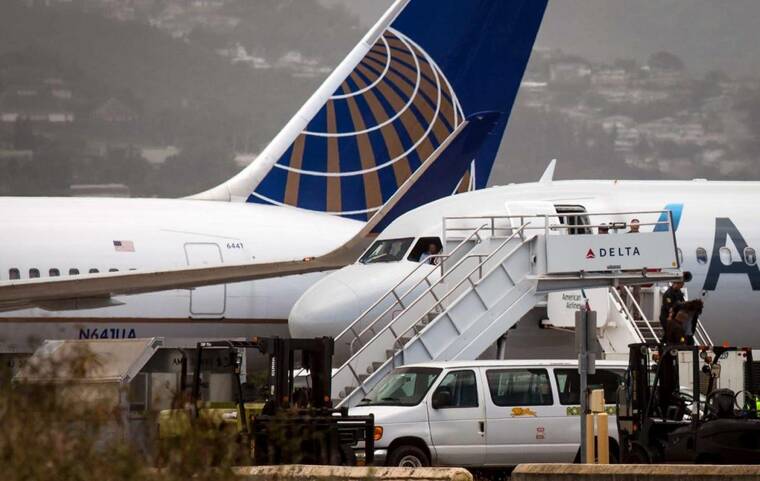 American and United prepare capacity cuts over fuel costs