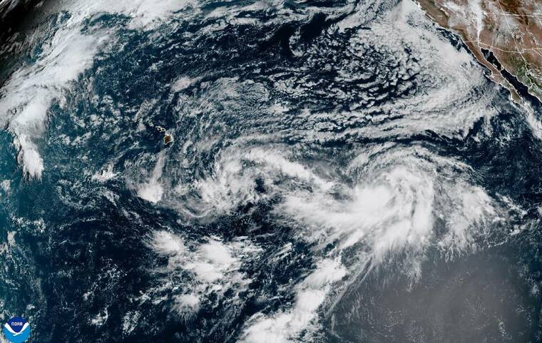 COURTESY NOAA
                                A satellite image at 9 a.m. today shows the remnants of former Tropical Depression 15-E near Hawaii, along with Tropical Storm Odalys further east.