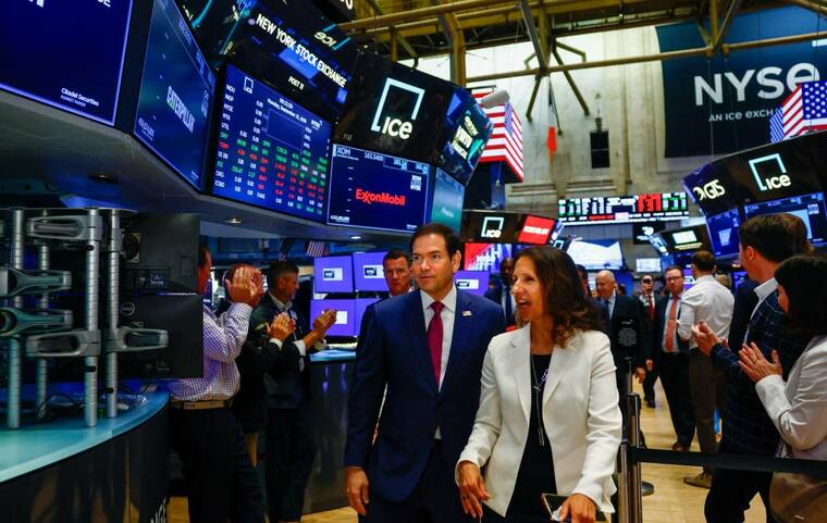 REUTERS/JEENAH MOON/POOL
                                Secretary of State Marco Rubio visits the New York Stock Exchange in New York City today. The Nasdaq surged to a record-high close today, lifted by gains in Advanced Micro Devices and other AI heavyweights.