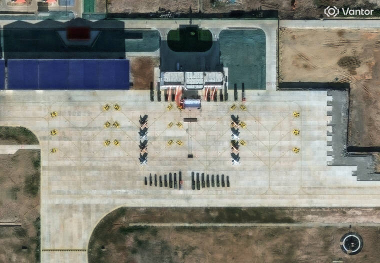 VANTOR/HANDOUT VIA REUTERS
                                A satellite image shows what security analysts believe are Y-8 light attack fighters and support vehicles at a new China-Laos joint training facility in Ban Keun, Vientiane Province, Laos, on Sept. 30.