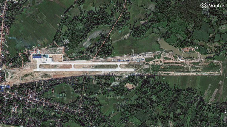 VANTOR/HANDOUT VIA REUTERS
                                A satellite image shows a new China-Laos joint training facility, with a runway that is being expanded, in Ban Keun, Vientiane Province, Laos, on Sept. 30.
